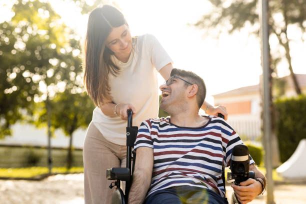 Caregiver with patient enjoying outdoor community time